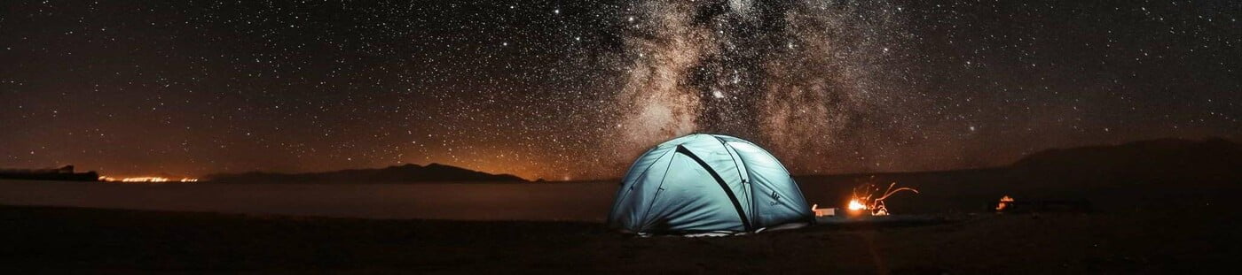 Camping under the night sky