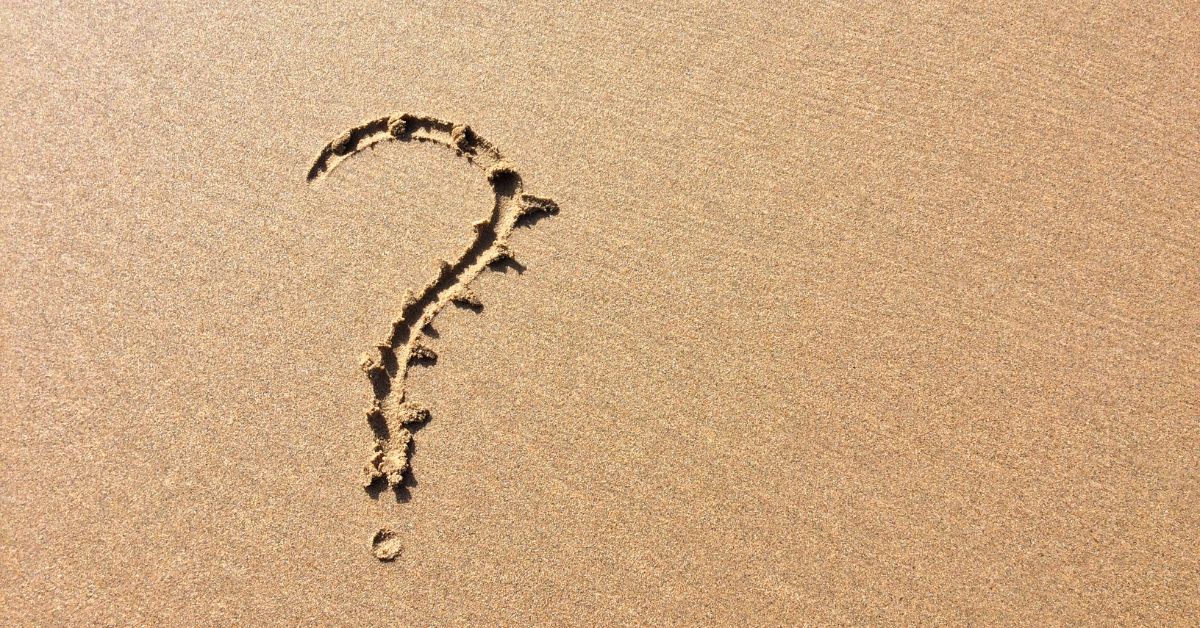 Question mark in sand