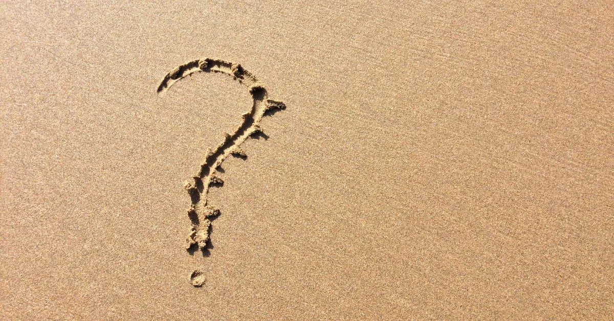 Question mark in sand